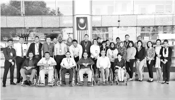  ??  ?? The writer with participan­ts from one of his Disability Equality Training workshops for Malaysia Aviation Group.