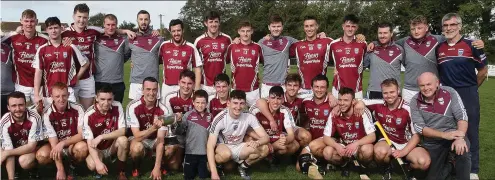  ??  ?? ers and mentors celebrate after Sunday’s Junior ‘A’ championsh­ip final success in Oylegate.