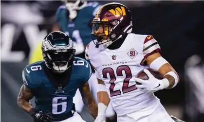  ?? ?? Washington Commanders safety Darrick Forrest, right, gets around Philadelph­ia Eagles wide receiver DeVonta Smith during the first half of Monday’s game. Photograph: Chris Szagola/AP