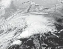  ?? AFP/GETTY IMAGES ?? A satellite image shows a winter storm forming over the Southeast on Sunday. Snow is forecast for the East today.