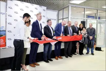  ?? HERALD PHOTO BY ALEJANDRA PULIDO-GUZMAN ?? Premier Jason Kenney, alongside MLA Nathan Neudorf, mayor Blaine Hyggen, Municipal Affairs Minister Ric McIver and other airport and city officials, cuts the ribbon Wednesday to celebrate the newly renovated Lethbridge Airport.