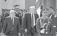  ?? FADI AROURI, AP ?? President Trump and Palestinia­n President Mahmoud Abbas review an honor guard Tuesday in Bethlehem in the West Bank.