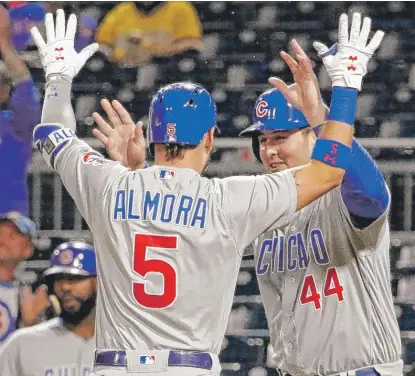  ?? | AP ?? Albert Almora Jr. celebrates with Anthony Rizzo after hitting a two- run home run in the seventh inning Thursday in Pittsburgh.