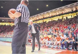  ?? ROBERTO E. ROSALES/JOURNAL ?? New Mexico coach Craig Neal argues with a referee in front of a Pit crowd on Saturday. Neal says his Lobos are proud to represent the fans.