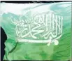  ??  ?? The Times Saudi flag: Saudi Arabia’s Sharia system advocates eye-for-an-eye punishment­s.