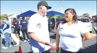  ?? PHOTO BY DENNIS ANDERSON/SPECIAL TO THE VALLEY PRESS ?? Brandon Scoggan (left) and Elvia Salazar, chair and co-chair of the Antelope Valley Homeless Coalition, confer on organizing services to offer, Tuesday, at the group’s first Homeless Community Resource Fair. During a recent homeless “point in time count,” the numbers of homeless people counted in the Antelope Valley rose from about 3,200 to more than 4,700.