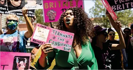  ??  ?? Picture research: CLAIRE CISOTTI
Free Britney: Fans hold up banners and cheer for star outside the court in Los Angeles on Wednesday