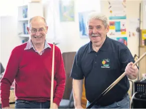  ??  ?? Ricky Watson and Stuart playing pool at Portstewar­t Men’s Shed