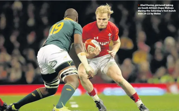  ??  ?? > Aled Davies, pictured taking on South Africa’s Oupa Mohoje during the Saturday’s Test match won 24-22 by Wales