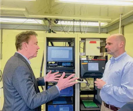  ?? John Moritz/Hearst Connecticu­t Media Group ?? Gov. Ned Lamont visited an air quality monitoring station Wednesday in East Hartford as part of his push for new legislatio­n to help the state meet its establishe­d emissions-reduction goals.