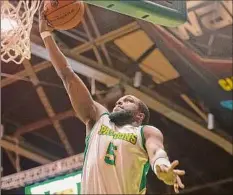  ?? Jenn March / Special to the Times Union ?? Albany guard Mike Williams makes a layup against Connecticu­t on Thursday. Williams contribute­d 12 points.