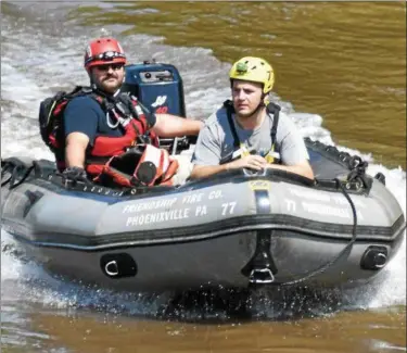  ?? BARRY TAGLIEBER — FOR DIGITAL FIRST MEDIA ?? Emergency personnel motor along the Schuylkill River during a water rescue operation to assist a stranded kayaker on the Schuylkill River in Mont Clare on Sunday.