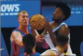  ?? CARLOS OSORIO — THE ASSOCIATED PRESS ?? Warriors center James Wiseman grabs a rebound next to Pistons center Mason Plumlee, left, during the first half on Tuesday in Detroit.