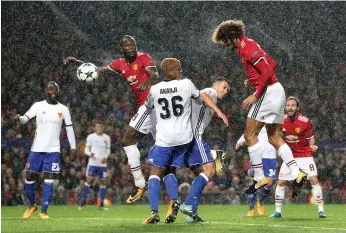  ?? Press Associatio­n ?? Marouane Fellaini, right, has made good on Jose Mourinho’s faith in him, providing key goals for Manchester United such as against Basel on Tuesday in Uefa Champions League