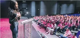  ?? JOHN MAHONEY ?? Aiesha Robinson speaks to students at Pierrefond­s Comprehens­ive High School about vitiligo, the disease she suffers from that destroys the pigment of her skin.