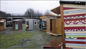  ?? BETH NAKAMURA/THE OREGONIAN VIA AP ?? In this March 7 file photo, tiny living pods for the Kenton Neighborho­od Tiny Home Pilot houses are viewed in Portland, Ore.