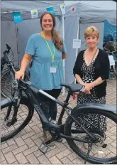  ??  ?? Lucy Cooke, left, of Kinlochlev­en Developmen­t Trust, with Maureen Fyfe, wife of the late Eoin Fyfe. The trust’s new e-bikes have been named ‘Fyfies’ after Eoin.