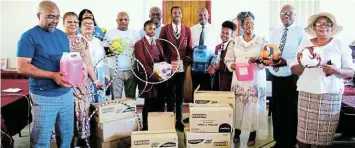  ?? SUPPLIED Picture: ?? MUCH APPRECIATE­D: The provincial delegation with local municipali­ty representa­tives, teachers and pupils hold items donated through the back to school programme at Nkwanca.
