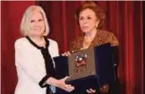  ??  ?? Director General of the Arab Women Organizati­on Ambassador Mirvat Al-Tellawi honors Haifa Abu Ghazalah.