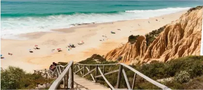  ?? ?? Beach-shack vibe: Sweep of golden sands at Comporta, Portugal, and inset top notch seafood