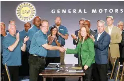  ?? — AFP ?? General Motors Chairwoman and CEO Mary Barra and United Auto Workers President Gary Jones opened the 2019 GM-UAW contract talks in July with the traditiona­l ceremonial handshake.