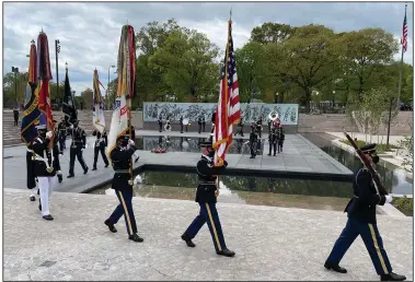  ?? (Arkansas Democrat-Gazette/Frank E. Lockwood) ?? Service members depart after the end of the National World War I Memorial ceremony in Washington on Friday. The memorial was designed by an Arkansan, Joseph Weishaar.