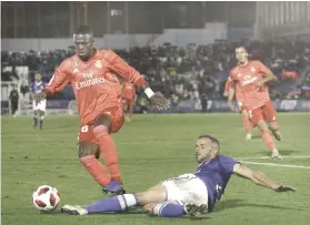  ?? AP FOTO ?? EASY WIN. Real Madrid’s Vinicius Junior tries to get past his defender during their Spanish Copa del Rey match against Melilla.