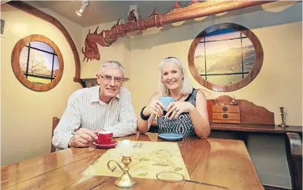  ?? Photo: KEVIN STENT/FAIRFAX NZ ?? Second breakfast: Parsonage Cafe owner Phil Saxby and designer Karen Cubis Smith have created a Hobbit and Lord of the Rings- inspired interior. Saxby says the cafe is visited by former Parsons customers every day. ‘‘A lot of the people are old...