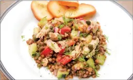  ?? Melissa d'Arabian via AP ?? Lentil and salmon salad with smoky mustard dressing.This recipe is by Melissa d’Arabian.