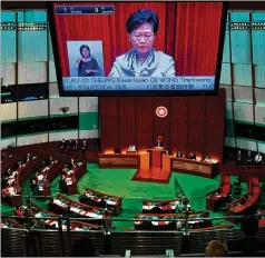  ?? VINCENT YU/ ASSOCIATED PRESS ?? Hong Kong Chief Executive Carrie Lam appears on screen Wednesday at a Legislativ­e Council session in Hong Kong. The U. S. has criticized China’s rewriting of Hong Kong’s election laws.