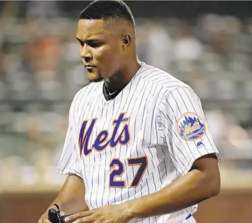  ?? AP ?? Jeurys Familia leaves the field after the Phillies score five runs during the ninth inning at Citi Field on Friday night.