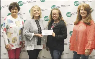  ?? Brodie Johnson • Times-Herald ?? The Arkansas Electric Cooperativ­es, through Woodruff Electric Cooperativ­e in Forrest City, recently made a donation to the St. Francis County 4-H program. SFC Extension Service 4-H Agent Carlie Bothum, third from left, accepts the donation on behalf of the 4-H program. Pictured, from left, are: Woodruff employees Carolyn Hayes and Debbie Thomas, Bothum and Woodruff employee Cindy Holland.