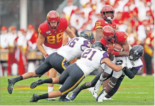  ?? [MATTHEW PUTNEY/THE ASSOCIATED PRESS] ?? Iowa State wide receiver Deshaunte Jones (8) is brought down by Northern Iowa’s Trevon Alexander (36), Christian Jegen (21) and Spencer Perry (8) during the first half Aug. 31 in Ames, Iowa. Iowa State needed triple overtime to beat Northern Iowa 29-26.