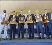  ?? HANS PENNINK — THE ASSOCIATED PRESS ?? Baseball Hall of Famers from left, Vladimir Guerrero, Trevor Hoffman, Chipper Jones, Jack Morris, Alan Trammell, and Jim Thome, hold their plaques after an induction ceremony at the Clark Sports Center on Sunday in Cooperstow­n, N.Y.