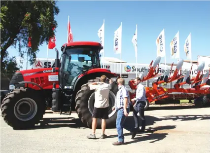  ?? (Picture by Justin Mutenda) ?? Officials at the Southern Region Trading Company inspect one of the latest tractor ploughs to be sold under CASE, a global leader in agricultur­e and farm equipment, at the group’s premises in Workington. The group is targeting to grow its market share...