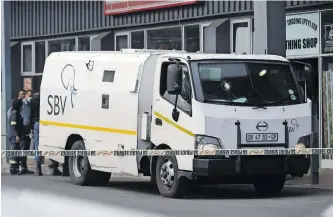  ?? PHANDO JIKELO ?? AN SBV CASH van at a scene of a robbery. A former Hawks captain who was involved in one of the biggest heists in the country in 2014 at an SBV cash depot now wants to challenge his conviction and 20-year sentence. I Independen­t Newspapers