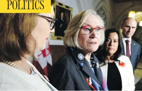  ?? JUSTIN TANG / THE CANADIAN PRESS ?? Carolyn Bennett, minister of Crown-Indigenous Relations, speaks about the government’s framework for the recognitio­n and implementa­tion of Indigenous rights, along with fellow ministers Jane Philpott, left, Jody Wilson-Raybould and Jean-Yves Duclos.