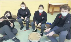  ?? ?? TY students Adrija, Ellen Curtin, Anna Roche and Ben O’Donovan drumming up some music in Coláiste Fionnchua.