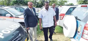  ?? CONTRIBUTE­D ?? Minister of National Security Robert Montague (second left) inspects some of the 20 motor vehicles now assigned to area and shift commanders at the Office of the Police Commission­er on Old Hope Road in St Andrew last Friday. Alaso pictured are Deputy...