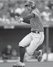  ?? [AP PHOTO] ?? Houston Astros’ George Springer celebrates after hitting a solo home run in the eighth inning of Game 3 of an American League Division Series against the Cleveland Indians, Monday in Cleveland.