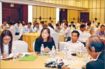  ?? PHA LINA ?? Government, employer and union representa­tives attend a consultati­on meeting on the draft universal minimum wage law in Phnom Penh on Tuesday.