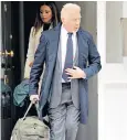  ?? ?? Boris Becker leaves his west London flat with his girlfriend ahead of the sentencing