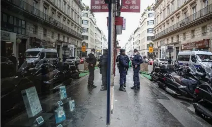  ?? Photograph: Mohammed Badra/EPA ?? Officers at the entrance of Palais Vivienne, owned by Pierre-Jean Chalençon, who is alleged to have organised clandestin­e dinners in Paris during lockdown.