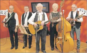  ??  ?? Garnet Buell and the Singing Islanders take part in a recent QEH/Eastlink Telethon. The group includes, from left, Donald MacKenzie, Gill Nowlan, Garnett Buell, Glenda Johnston and Jim Madsen.