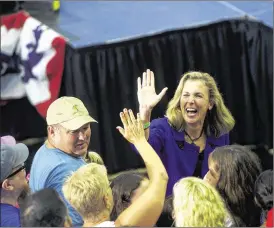  ?? MARK MAKELA / THE NEW YORK TIMES ?? Katie McGinty, Democratic candidate for U.S. Senate in Pennsylvan­ia, high-fives a supporter at Hillary Clinton rally in Philadelph­ia in July. Various flaws mar many of the party’s candidates for Senate.