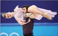  ?? David J. Phillip / Associated Press ?? Madison Hubbell and Zachary Donohue perform their routine in the ice dance competitio­n during the Winter Olympics on Monday.