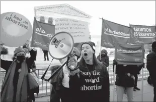  ?? Yuri Gripas / Abaca Press /TNS ?? Pro-abortion rights protesters rally outside as the U.S. Supreme Court hears arguments in “Dobbs v. Jackson Women’s Health Organizati­on” in Washington, D.C. on Wednesday.