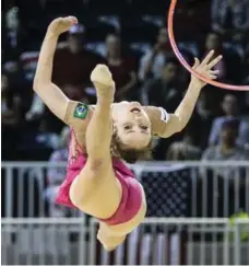  ?? BERNARD WEIL/TORONTO STAR ?? Brazilian Angelica Kvieczynsk­i performs in the hoop portion of Friday’s qualifying at the Coliseum. She’s third overall after day one.