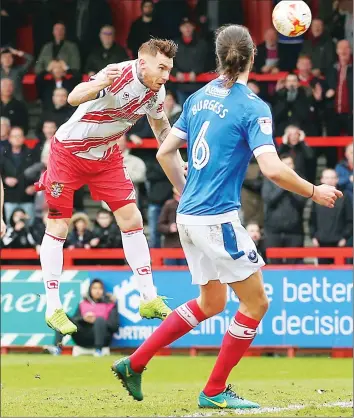  ??  ?? LONG LIVE THE KING: Jack King powers in a header for Stevenage’s opener