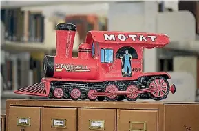  ??  ?? The large model steam train was painstakin­gly crafted from papier mache into a money box.